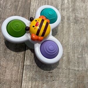FREE with any baby,kids,maternity purchase. Spinning popper suction toy.